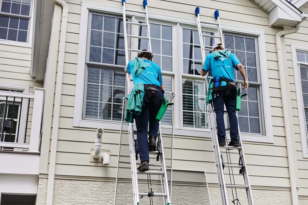 High exterior window cleaning for difficult-to-reach windows on a two-story home