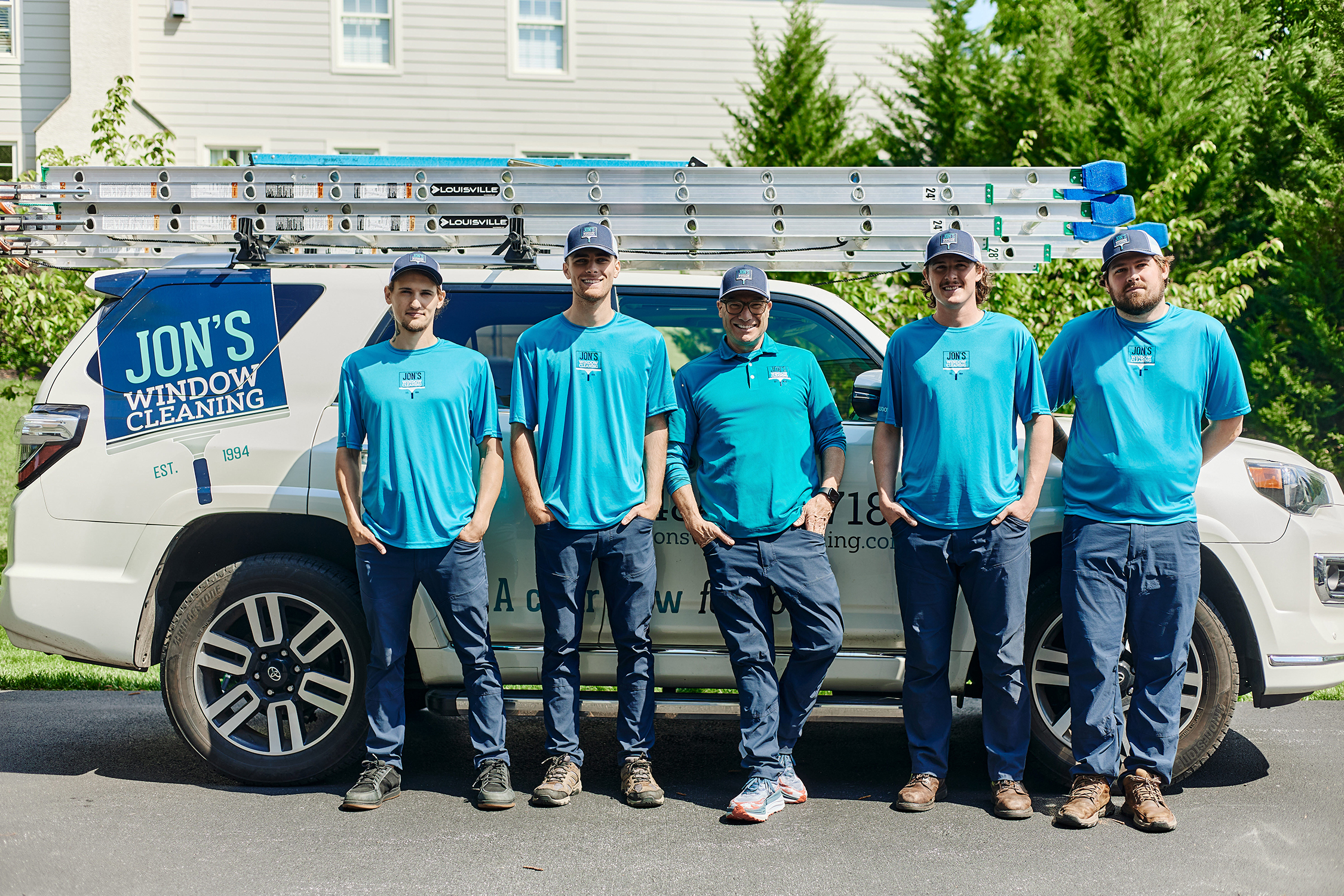 Jon’s Window Cleaning team in Chester County PA – five professional residential window cleaners standing in front of the company truck