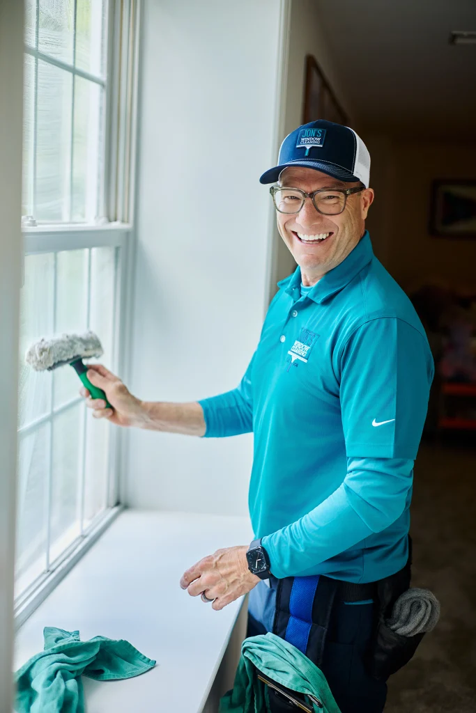 Exterior home glass cleaning removing dirt and buildup from residential windows